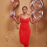 Number-3-2-2024-aou-photo-studio-celebration-girl-in-red-dress-with-foil-balloons-and-confetti.jpg.
