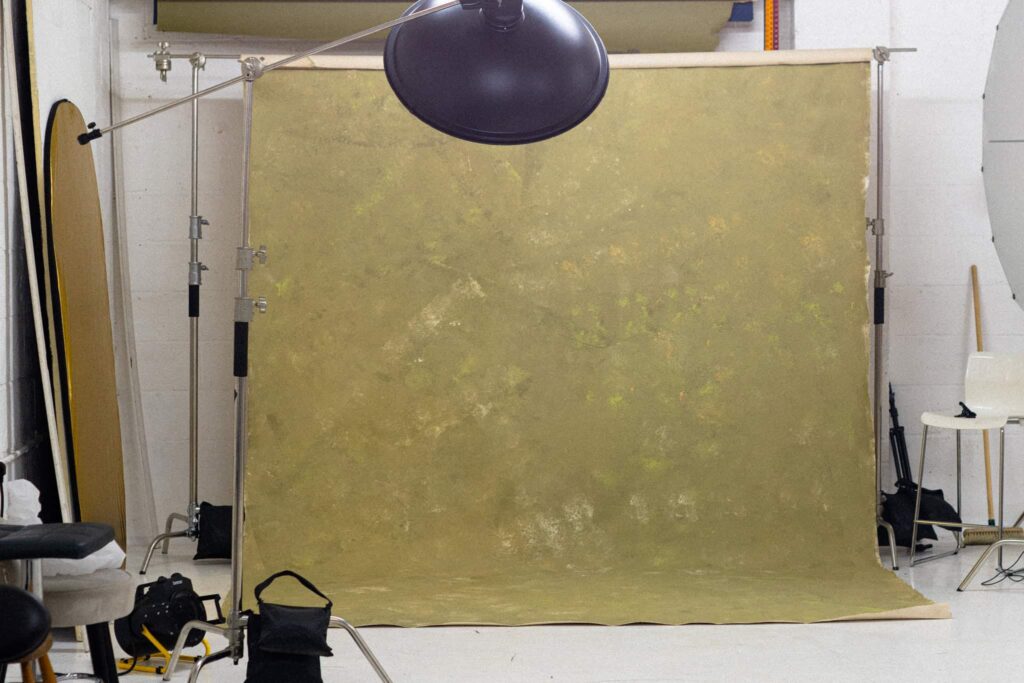 Hand-painted textured photography backdrop with studio lights